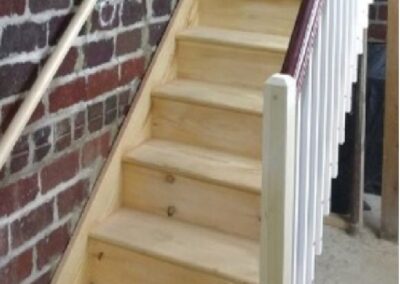 Wooden Stairs and White Railings